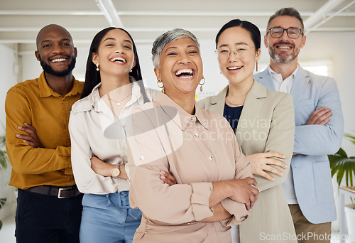 Image of Business people, laughing and arms crossed portrait in a office with diversity and senior woman ceo. Company, management team and funny joke of professional leadership and creative agency group