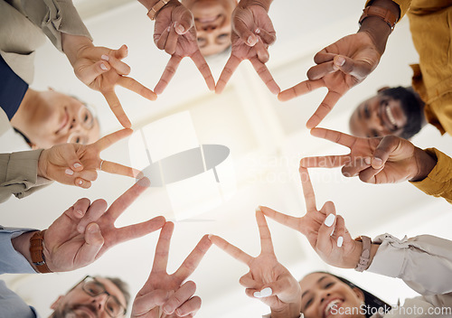 Image of Peace, hands and business people in office for teamwork, collaboration and support low angle. V, star and happy team in solidarity, commitment or positive coworking agreement, trust or motivation