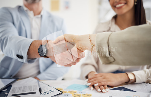 Image of Business people, handshake and meeting in teamwork, hiring or partnership together at office. Closeup of employees shaking hands in team agreement, b2b deal or thank you in recruiting at workplace