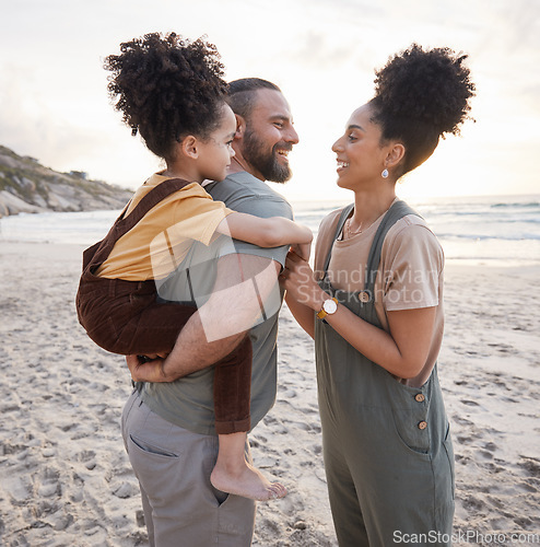 Image of Piggyback, family and smile at beach at sunset, bonding and having fun together. Happy, mother and father of kid at ocean in interracial care on summer holiday, vacation trip or travel outdoor at sea