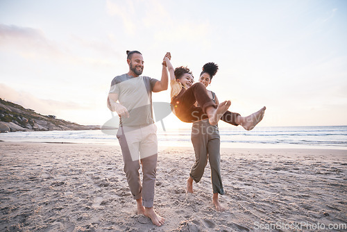 Image of Happy, swing and holding hands with family at beach for bonding, summer vacation and travel. Smile, sunset and relax with parents and child walking on seaside holiday for love, freedom and support