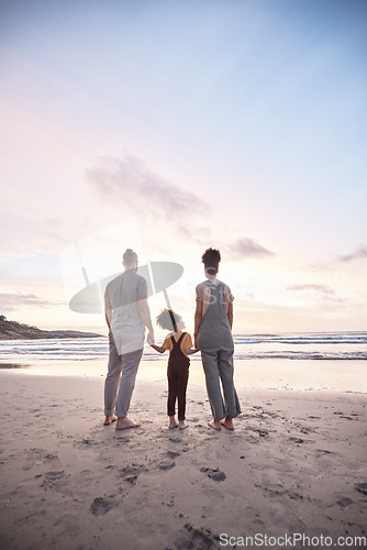 Image of Back view, family at beach and holding hands at sunset, bonding or fun outdoor on mockup space. Rear, sea and father, kid and mother at ocean in interracial care, summer holiday or vacation to travel