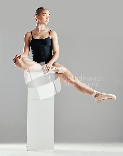 Image of Elegant, ballet or woman on block in studio in creative performance for balance or freedom. Girl dancer, mock up or ballerina stretching or training to exercise legs on platform or white background