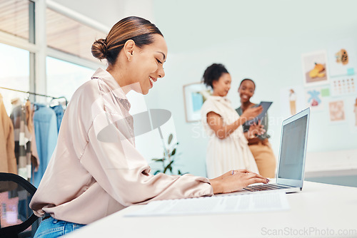 Image of Laptop typing, woman and at a boutique for fashion, communication and working in retail. Smile, ecommerce and a female stylist or girl with a computer for online website for a clothing store