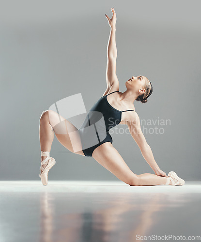 Image of Dance performance, ballet or woman in studio training for wellness, balance or creative freedom. Body, dancer or girl ballerina stretching arms to exercise or practice routine on white background