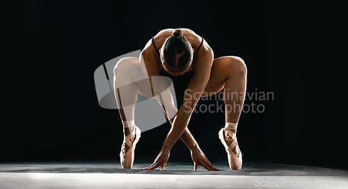 Image of Art, ballet and flexible woman on black background in dance performance with balance, stretching and talent. Dark aesthetic, ballerina or dancer training with fitness, creativity and studio exercise.