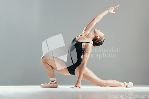 Image of Dance, ballet and woman stretching in art performance in studio isolated on gray background mockup space. Ballerina, theatre or creative person training, workout or exercise, healthy body or flexible