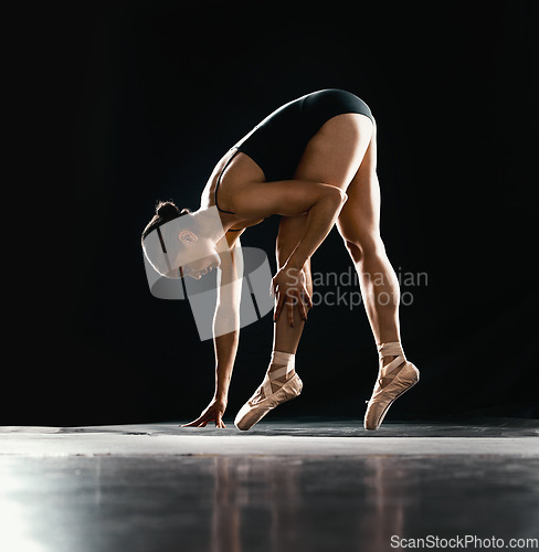 Image of Ballet, woman or dancer with training, talent or performance on a dark studio background. Female performer, ballerina or artist with technique, prepare for a show and creative with fitness and pose