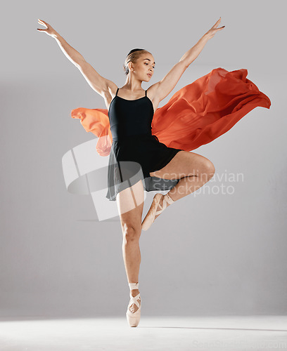 Image of Ballet, artist and woman with pose, training or elegant art with performance on white studio background. Female performer, ballerina or dancer with technique, practice routine and creative person