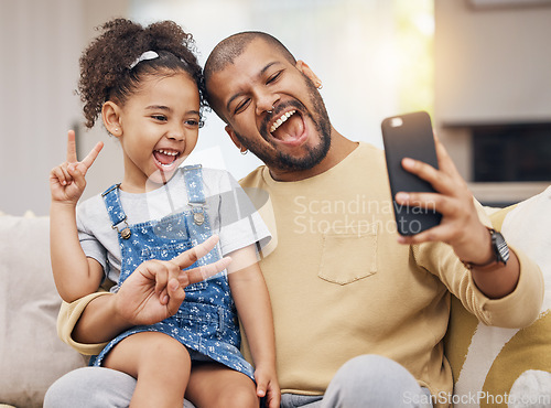 Image of Father, girl and peace sign selfie in home living room, bonding and funny together. Dad, child and excited in v hand on profile picture, happy memory or social media post of family laughing on sofa