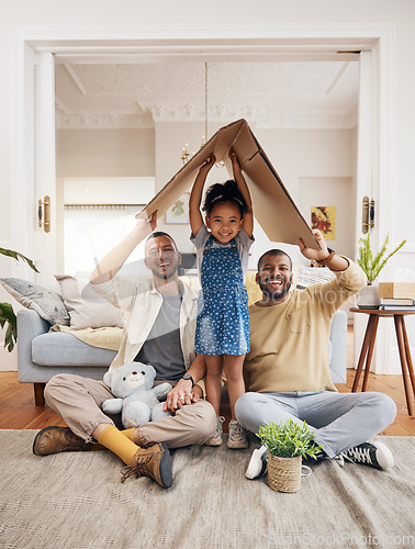 Image of Gay, happy family and a child with cardboard home or roof with love, care and safety in a lounge. Lgbtq men, adoption and parents with a foster girl kid together for new house, mortgage and insurance
