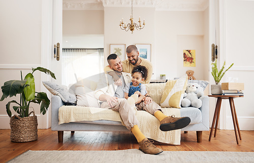 Image of Gay, happy family and a child on a sofa at home with love, care and safety in a lounge. Lgbtq men, adoption and parents with a foster girl kid together on a couch for happiness, bonding and to relax