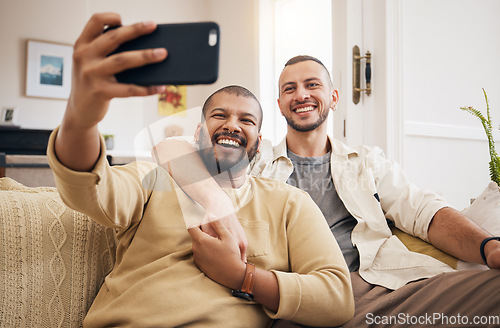 Image of Men, lgbtq couple and funny selfie in home living room, bonding and laughing together. People, gay and profile picture, happy memory or smile on social media in love, care and interracial hug on sofa