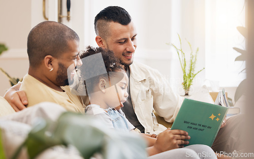 Image of Gay couple, child and book on sofa with smile, bonding and love in storytelling in living room together. Happiness, lgbt men and girl reading story on couch in fantasy, learning and education in home