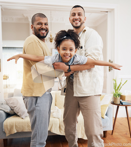 Image of Gay parents, girl and portrait of playing in home or holding kid as a plane, lifting or flying in living room for fun bonding game. Happy family, father and dad support child in the air or lounge