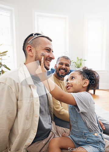 Image of Blended family, gay father and makeup with a daughter in the living room of her home for princess fantasy. LGBT, love or adoption and a girl together with her parents on the sofa for bonding closeup