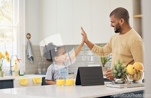 Image of Dad, girl and high five for learning on tablet in home, kitchen and online, app or education games on tech in living room. Happy, black family or father with support in success, achievement or growth