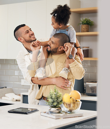Image of Happy family, child and gay parents in home together with love, support and bonding with girl on shoulders of dad in hug. LGBT, fathers and men with happiness or smile in kitchen and playing with kid