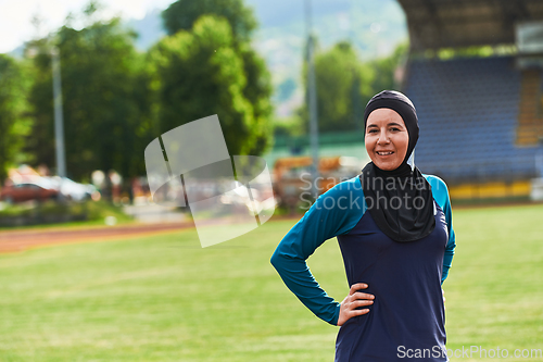 Image of A Muslim woman with a burqa, an Islamic sportswoman resting after a vigorous training session on the marathon course. A hijab woman is preparing for a marathon competition