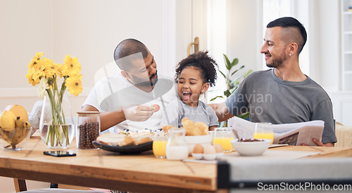 Image of Gay couple, breakfast and parents feeding kid meal, food or strawberry for morning wellness, nutrition and development support. Healthy family, home fruit and homosexual father smile for hungry child