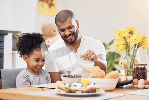 Image of Home, breakfast and father with girl, cereal and help with milk, nutrition and family with food. Male parent, child and kid with healthy meal, start the day and dad with support, hungry and happy