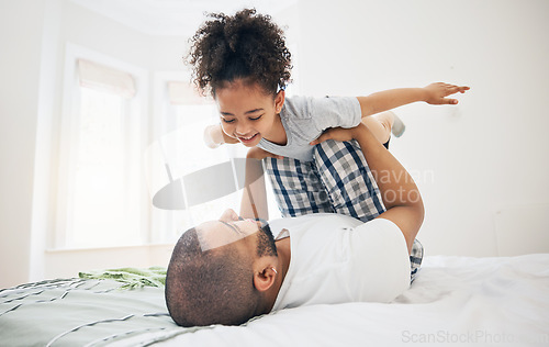 Image of Dad, child and bed with airplane game, happy bonding and fun morning playing for father and daughter in home. Family, love and playful energy, man holding girl in air and laughing in bedroom together