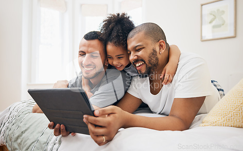 Image of Child, gay family and tablet on bed at home for e learning, watch video and education on internet. Adoption, lgbt men or parents with happy kid and technology for streaming movies, games or funny app