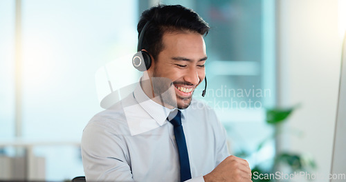 Image of Call center agent consulting a buyer via video call in an office. A young friendly sales man talking to a client in a virtual meeting. A male customer service employee advising a consumer