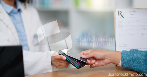 Image of Closeup customer hands using ebanking credit card to pay on contactless nfc machine to collect prescription medication from pharmacist. Man tapping or scanning electronic device for pharmacy medicine