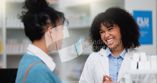 Image of Young female chemist helping a customer to purchase prescription or chronic medication in the pharmacy. Young woman shopping for medicine and being assisted with advice by a doctor in a labcoat