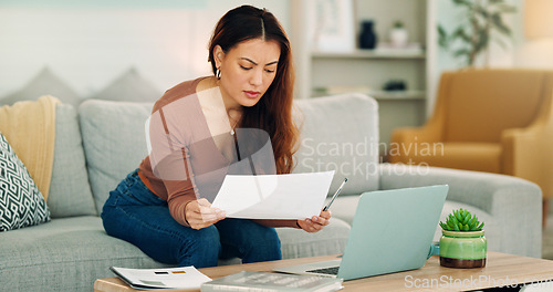 Image of Woman, paper and laptop in living room on sofa working on project, assignment or task for college or business. Student, girl and home to study, for test or exam at university with handheld movement