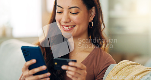 Image of Woman, phone or credit card for ecommerce, online shopping or bank app in Colombian house living room or home sofa. Smile, happy and relax customer on fintech technology or e commerce retail software