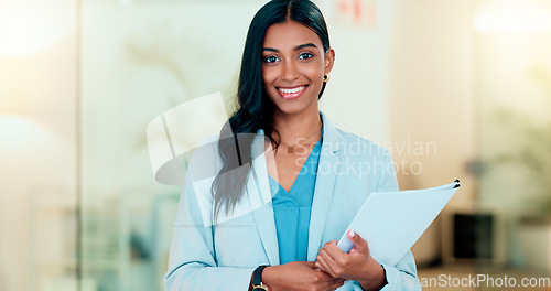 Image of Happy, confident and successful businesswoman holding files while doing admin in an office. Female executive and entrepreneur ready to work with a positive attitude. HR manager ready to do interview