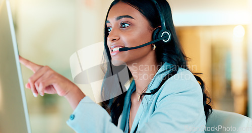 Image of Professional and helpful call centre woman using a headset, assists business consult. Helpful support service agent talks with client on call. Remote worker gives client advice telephonically