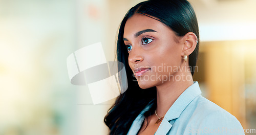 Image of Business woman reading information on a computer screen while working in an office. Closeup on face of one confident young entrepreneur and focused expert carefully analyzing ideas and plans online