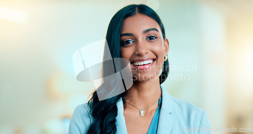 Image of Satisfied, confident entrepreneur doing an online training for a remote, distance job. Closeup face portrait of a successful business woman standing and smiling against a bokeh, copyspace background.