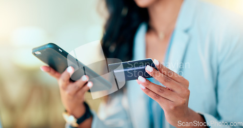 Image of Bank card data put in phone by a lady who does internet banking by typing on her mobile to make an online credit payment. Young woman texting on her phone to send money via an ewallet transaction