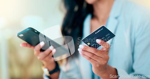 Image of Bank card data put in phone by a lady who does internet banking by typing on her mobile to make an online credit payment. Young woman texting on her phone to send money via an ewallet transaction