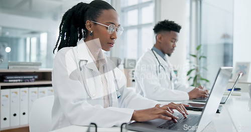 Image of Doctor, hospital team and laptop working with research and medical data in laboratory office. Black people, professional and working for healthcare, wellness and science on a computer with info