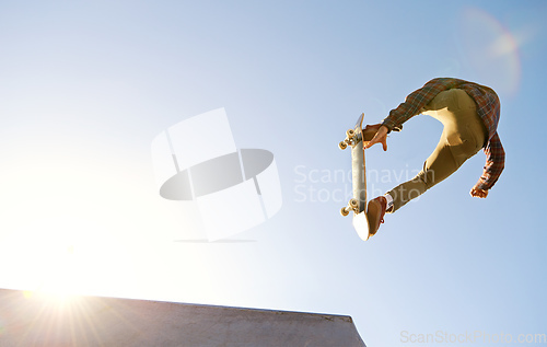 Image of Have you see the skills on this one. A young man doing tricks on his skateboard at the skate park.