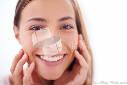 Image of Youthful radiance. A young woman smiling at the camera - closeup.