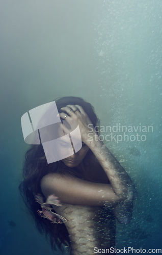 Image of Beautiful yet unhuman. A beautiful mermaid underwater - ALL design on this image is created from scratch by Yuri Arcurs team of professionals for this particular photo shoot.