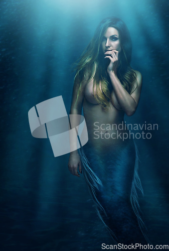 Image of Shes a creature of myth and magic. A beautiful mermaid underwater - ALL design on this image is created from scratch by Yuri Arcurs team of professionals for this particular photo shoot.