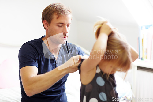 Image of Father-daughter bonding. Shot of a young father bonding with his little daughter.