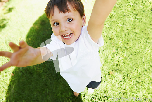 Image of Yay Its time to play. High angle view of a little boy reaching up into the air.