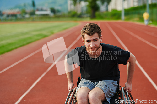 Image of A person with disability in a wheelchair training tirelessly on the track in preparation for the Paralympic Games