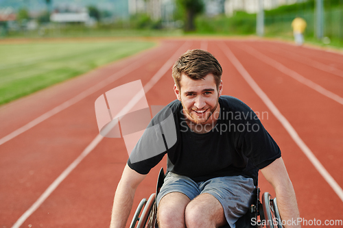 Image of A person with disability in a wheelchair training tirelessly on the track in preparation for the Paralympic Games