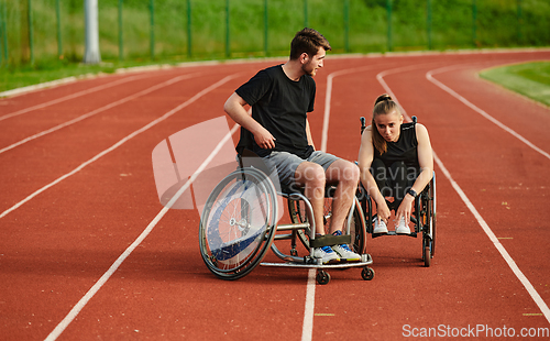 Image of An inspiring couple with disability showcase their incredible determination and strength as they train together for the Paralympics pushing their wheelchairs in marathon track