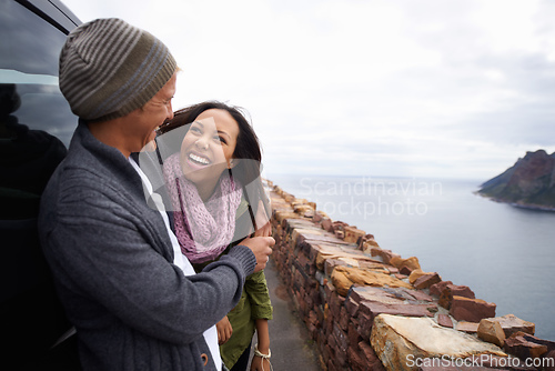 Image of What a view. Shot of a young couple enjoying themselves on a drive.