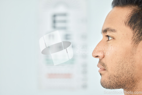 Image of Man, face and clinic eye exam for vision, optometry and wellness for prescription lens on space. Closeup person, thinking and serious patient in optometry, ophthalmology and assessment for eyesight